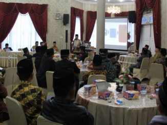 H. Gusmal, SE. MM saat memberi sambutan pada Rapat Koordinasi LKAAM Kab. Solok