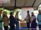 Penyerahan bantuan untuk korban bencana galodo Nagari Guguak Malalo.