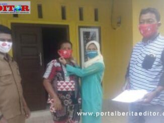 Penterahan bantuan masker di Pariaman.