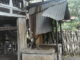 Rumah yang rusak dilanda angin kencang.