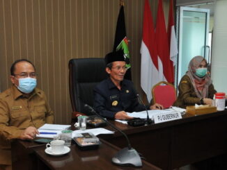 Pj. Gubernur Sumbar, Hamdani saat rakor virtual denngan Bappenas.