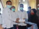 Wako Genius Umar menyerahkan bantuan Baznas.