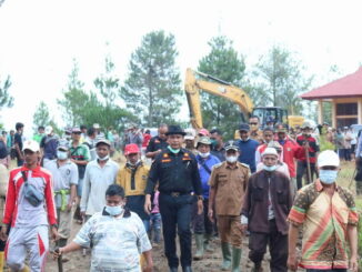 Launching pemakaian excavator di Tanjung Alai.