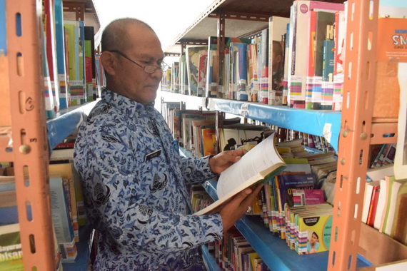 Kepala Dinas Perpustakaan dan Kearsipan Kab, Solok Selatan.