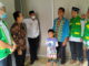 Wabup Risnawanto saat penyerahan Huntara.