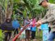 Praktek penggunaan Alsintan Cultivator di Kebun KWT Flamboyan 38 Kelurahan Bukit Apit Puhun.