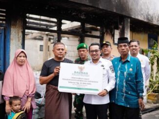 Penyerahan bantuan sebanyak Rp. 21 juta untuk korban kebakaran di Jorong Parak Juar Nagari Baringin.