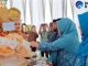 Penyambutan tim Penilai lomba TP PKK Propinsi Sumbar di Kelurahan Koto Selayan dengan sirih di carano.