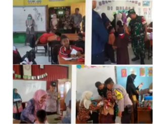 Petugas kesehatan memberikan imunisasi campak kepada anak di SDIT Al Ishlah Bukittinggi dalam kegiatan Outbreak Response Immunization (ORI) Campak.